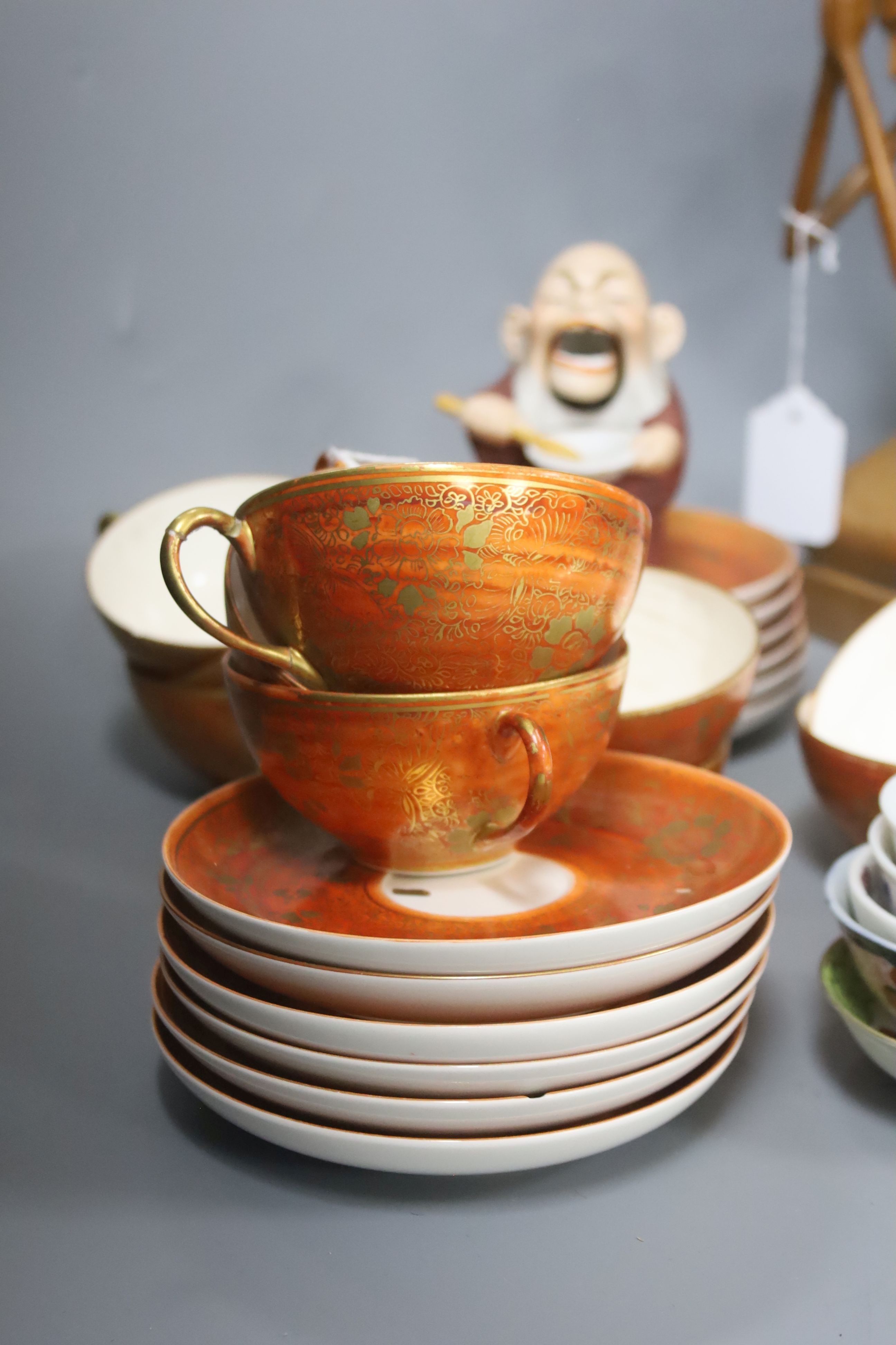 A Japanese orange and gilt eggshell porcelain tea service (24-piece) and sundry items
